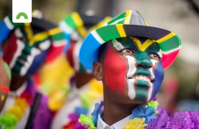 man with SA flag painted face