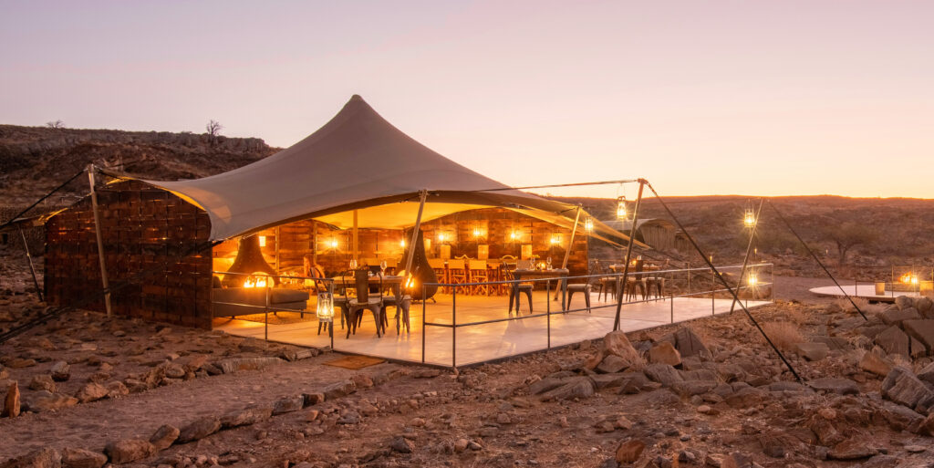 Scenic drive from Etosha to Damaraland with a Magic Box picnic en route, ending with fireside sundowners at Camp Doros in Namibia’s remote desert landscapes.